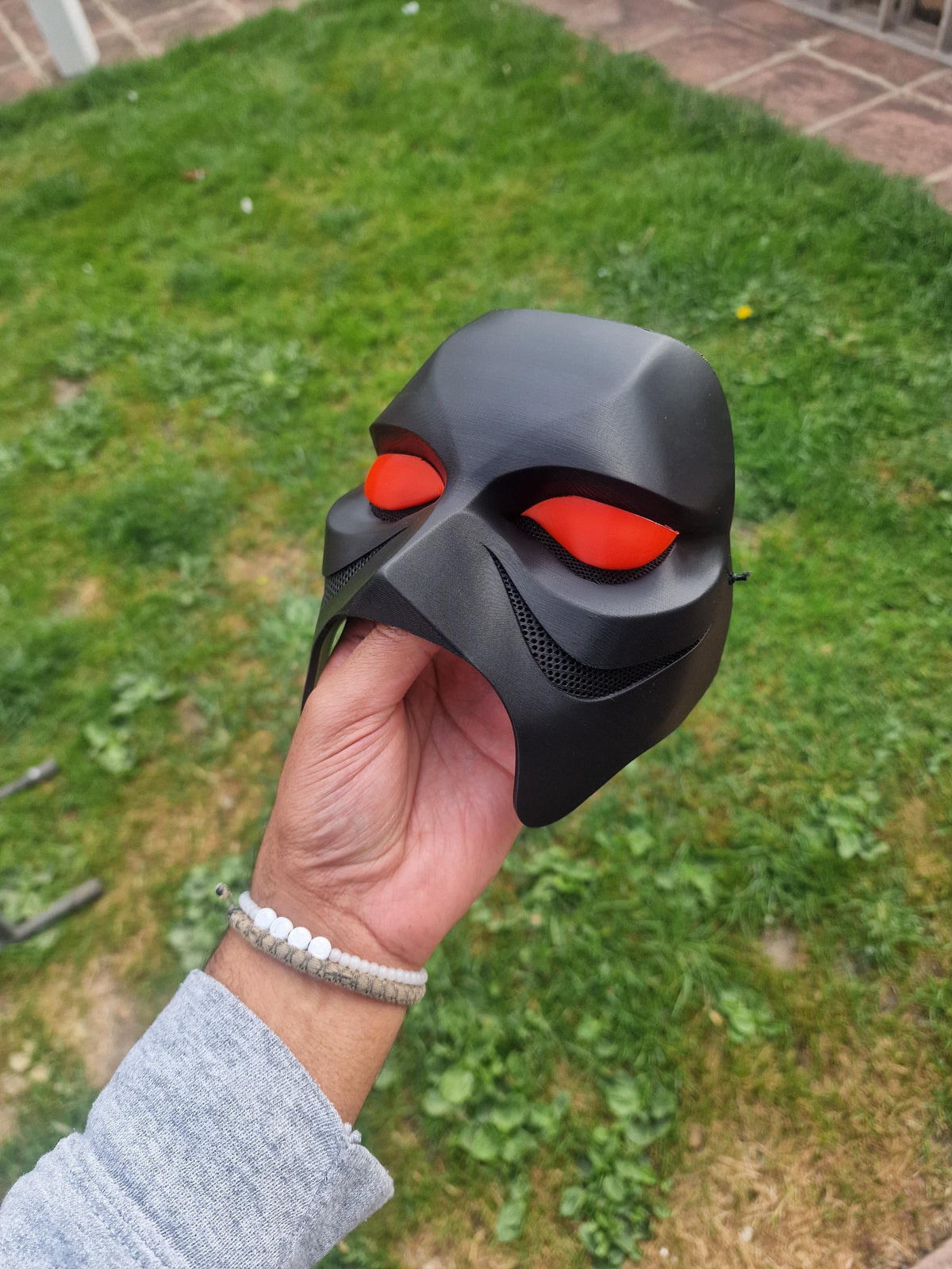 Black Weeknd 2026 tour mask with red eyes