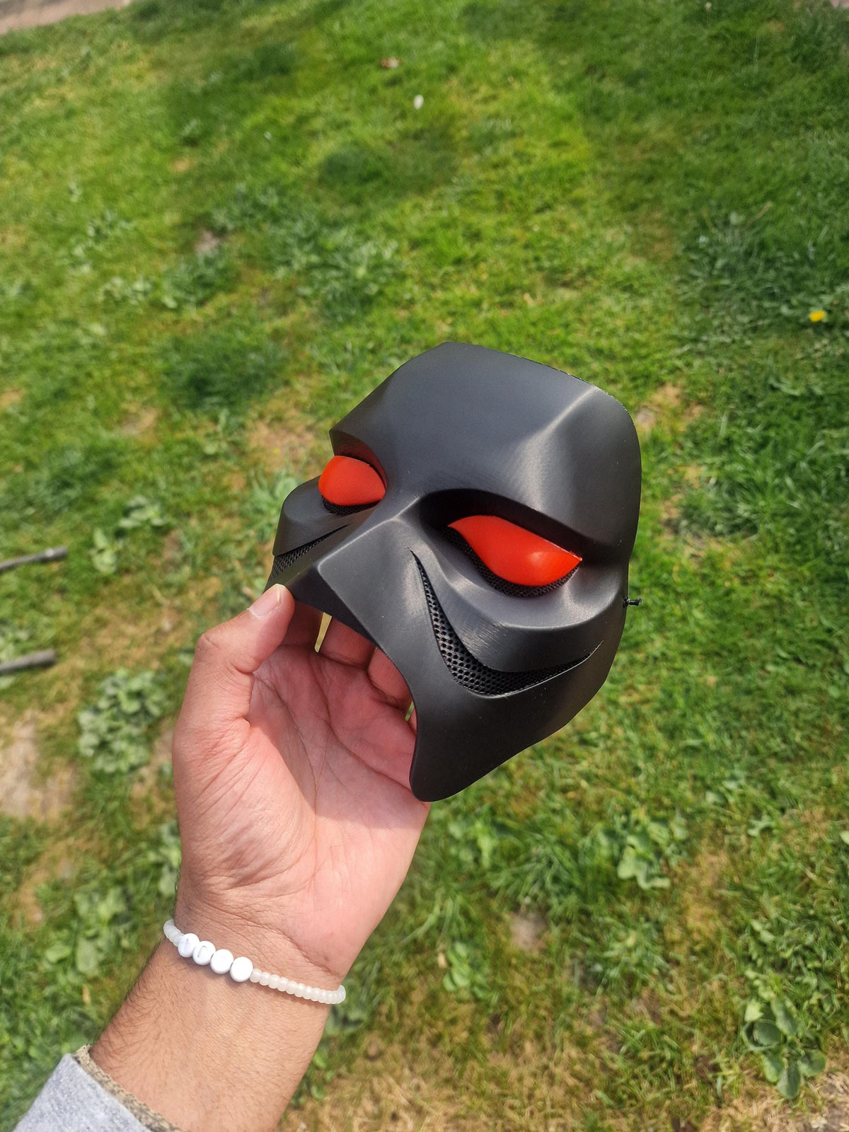 Weeknd 2026 tour mask with red eye sockets and mesh detailing