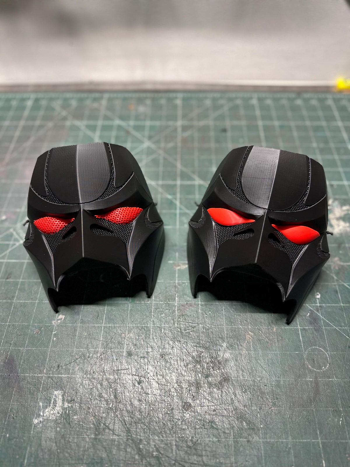Matte black mask pair with red mesh eyes